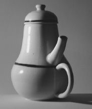 FIGURE 1.1. Coffeepot for Masochists. The French artist Jacques Carelman in his series of books Catalogue d’objets introuvables (Catalog of unfindable objects) provides delightful examples of everyday things that are deliberately unworkable, outrageous, or otherwise ill-formed. One of my favorite items is what he calls “coffeepot for masochists.” The photograph shows a copy given to me by collegues at the University of California, San Diego. It is one of my treasured art objects. (Photograph by Aymin Shamma for the author.)